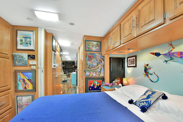 An RV bedroom looking into the hall from RV Renovations Complete The Big Reveal