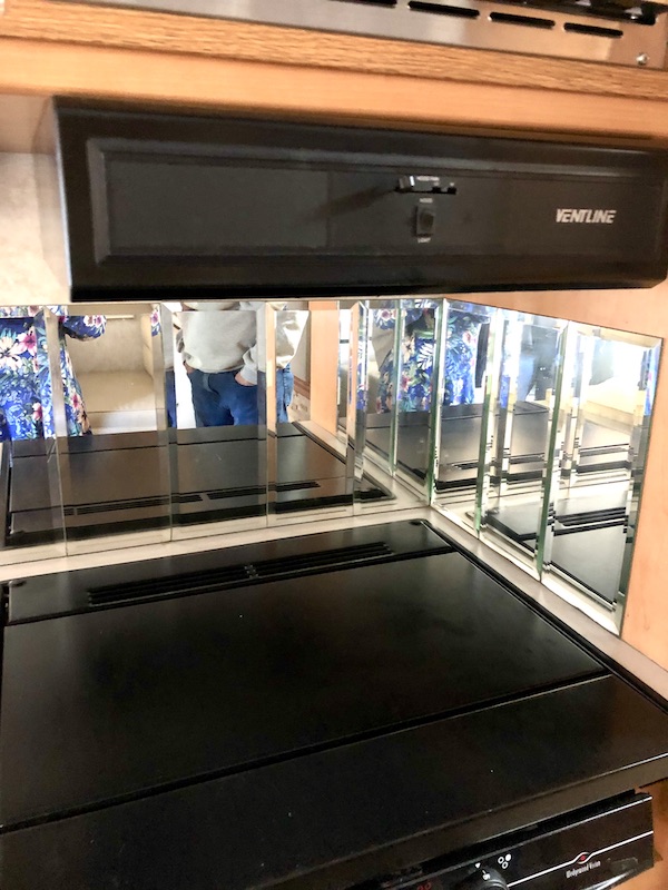 RV kitchen stop top and mirror backsplash from RV Renovations Complete The Big Reveal