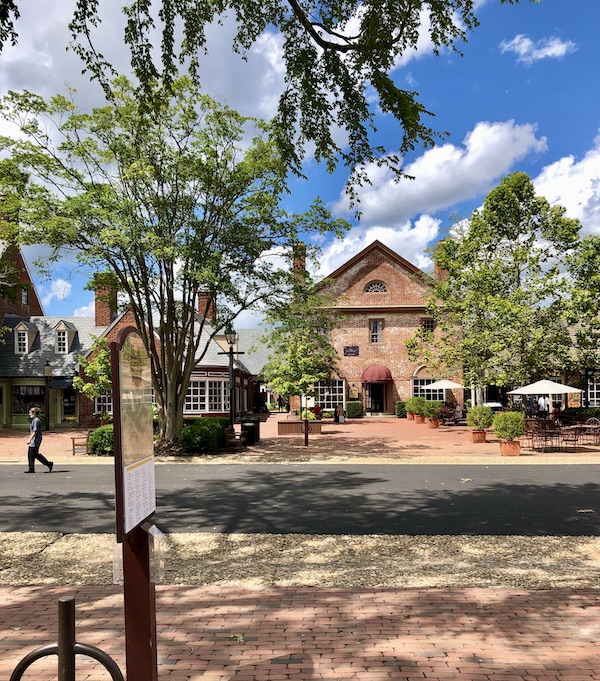 An old brick building and trees in Williamsburg Virginia