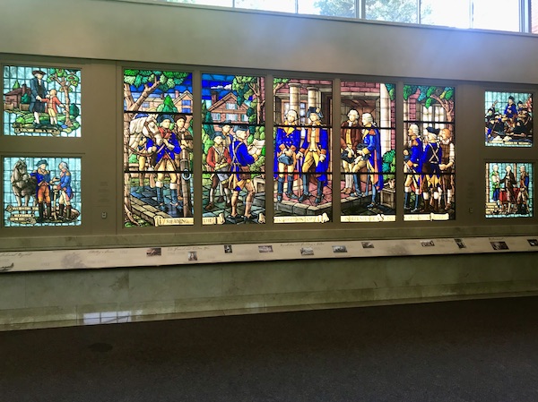 A series of brightly colored stained glass windows at George Washington's Mount Vernon Welcome Center