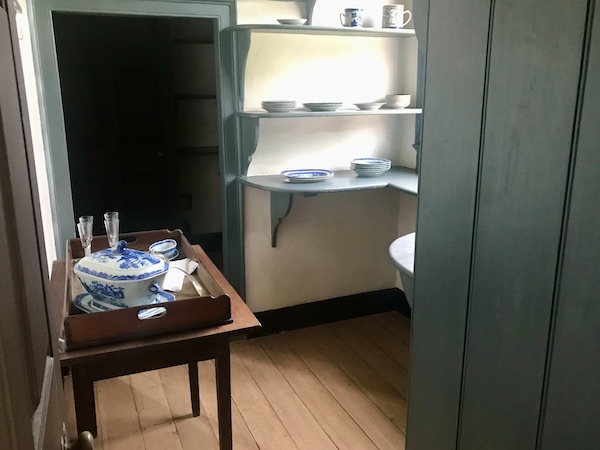 A room with shelves of dishes at George Washington's Mount Vernon