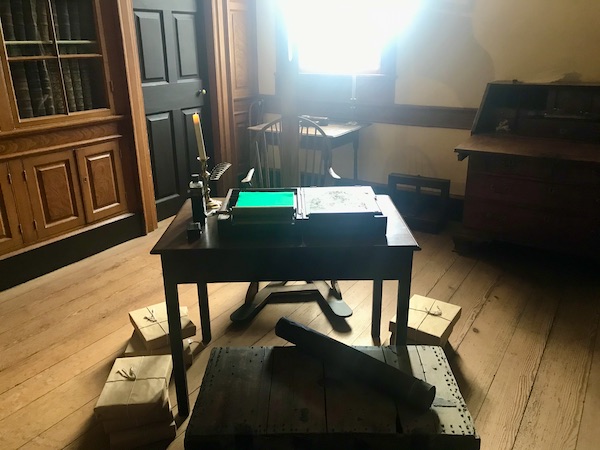 An old desk with boxes on the floor at George Washington's Mount Vernon