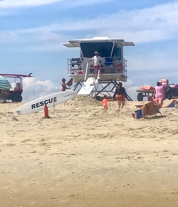 Maryland and Virginia Beaches sand with lifeguard stand.