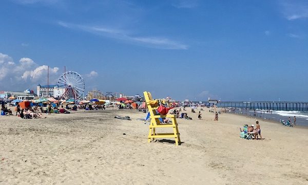 Maryland and Virginia Beaches with a large yellow Adirondack chair.
