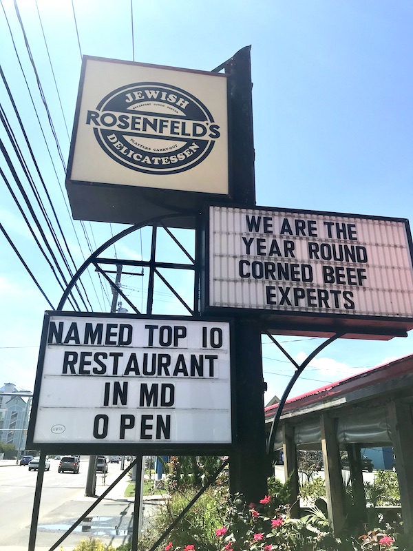 A trio of black and white signs for Rosenfeld's Jewish Delicatessen in Maryland and Virginia Beaches