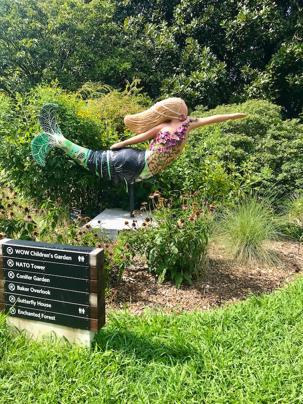 A mermaid sculpture in the garden at the Norfolk Botanical Gardens