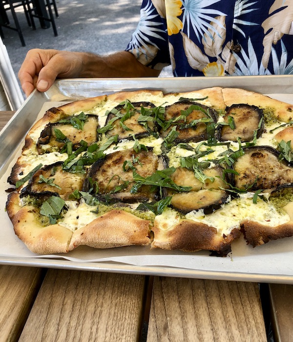 A rectangular pizza topped with eggplant slices from Vin 909 in Annapolis Maryland