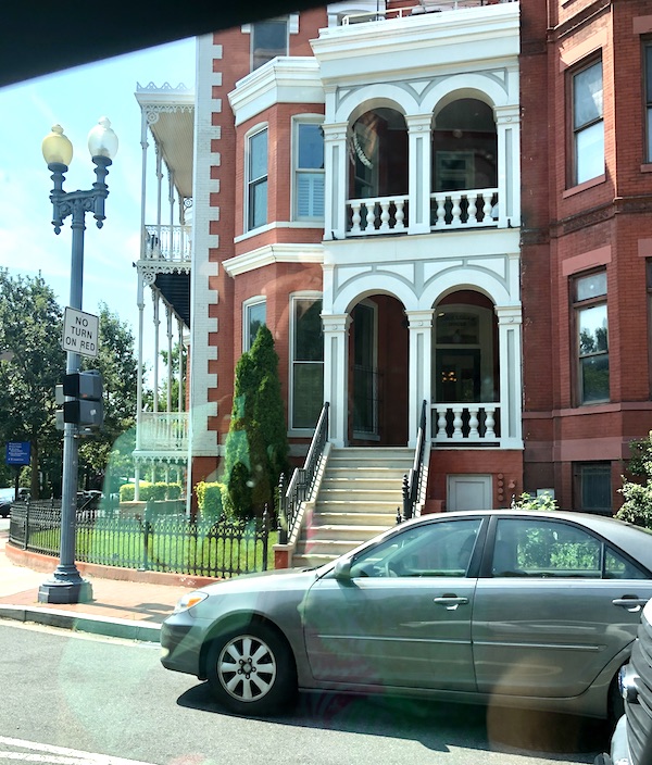 Red brick townhomes with white trim in Washington DC and Annapolis Maryland