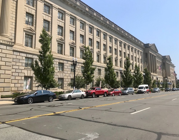 A large tan building that spans an entire block in Washington DC and Annapolis Maryland