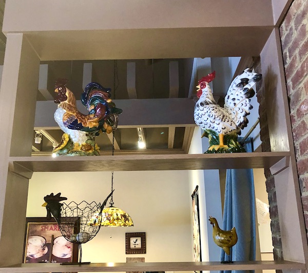 Shelves in a restaurant with ceramic chickens on display in Atlanta Georgia