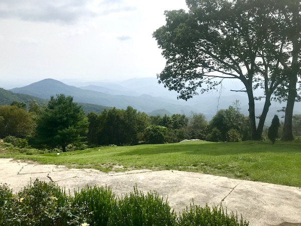 A white stone path, lawn, trees and Mountains near Boone North Carolina