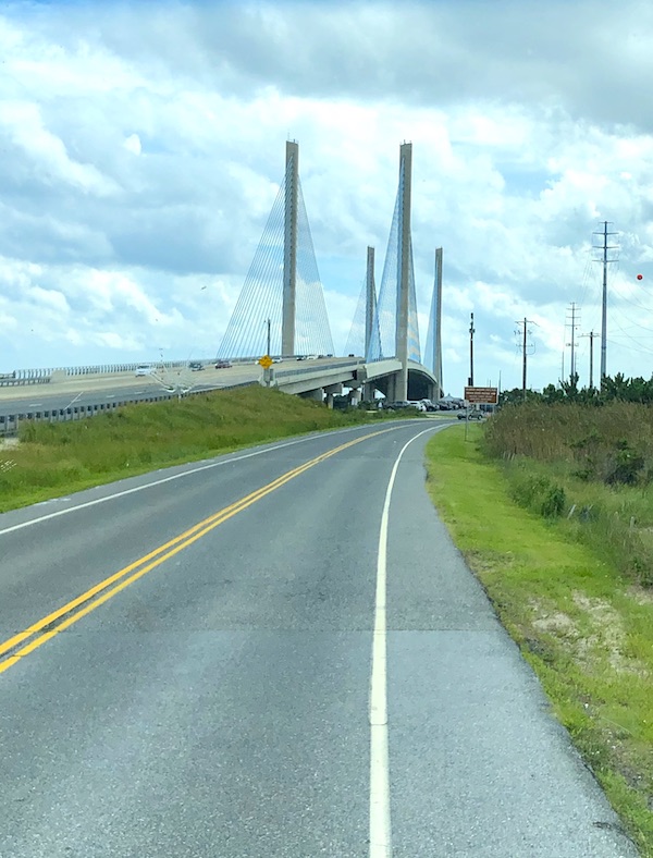A highway with a unique bridge that spans Delaware Seashore State Park