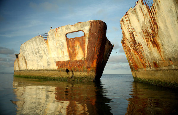 A pair of decaying concrete ships in the water at Kiptopeke State Park in Virginia