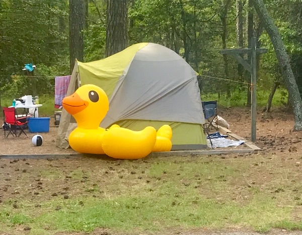 A tent on the lawn with a huge yellow rubber ducky at Kiptopeke State Park in Virginia