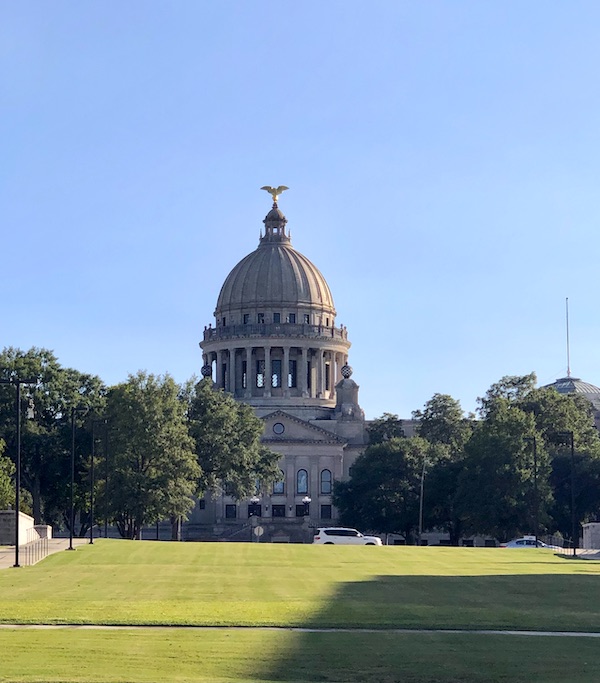 There back of a large domed building with a huge lawn in front in Jackson Mississippi