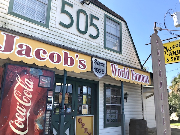 A storefront with a yellow awning the says Jacob's World Famous in LaPlace Louisiana