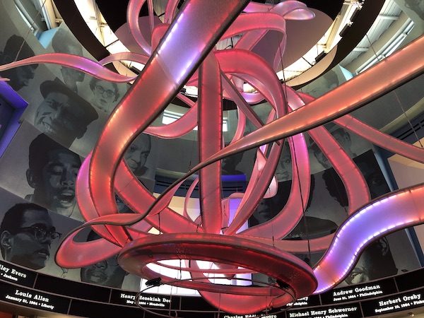 Rose colored lit ribbons form a sculpture at the Mississippi Civil Rights Museum