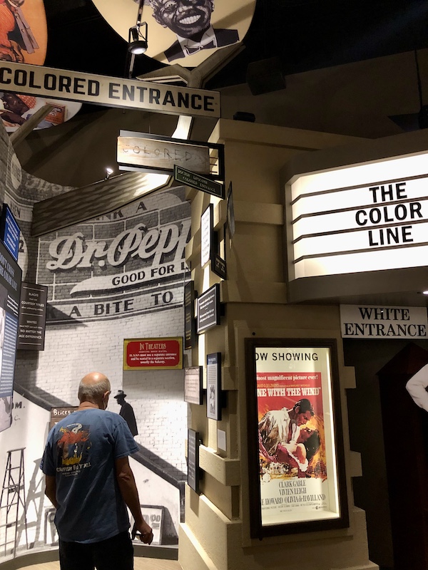 A movie theater entrance showing separate entrances for blacks and whites at the Mississippi Civil Rights Museum