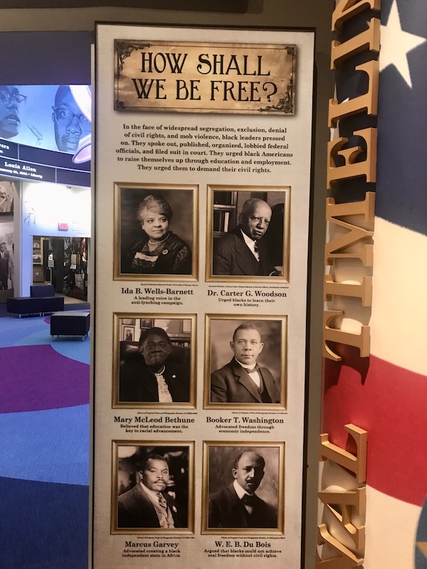 A sign with verbiage and photos of freedom fighters at the Mississippi Civil Rights Museum