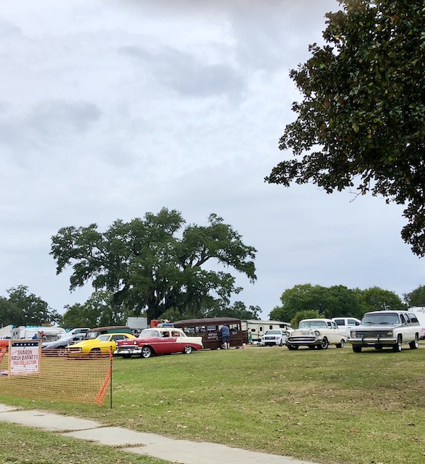 A row of old cars on display along our route from NOLA to Biloxi