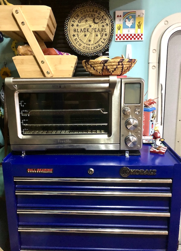 A blue tool chest with a toaster oven on top that was used to bake a Pumpkin Chocolate Chip Loaf