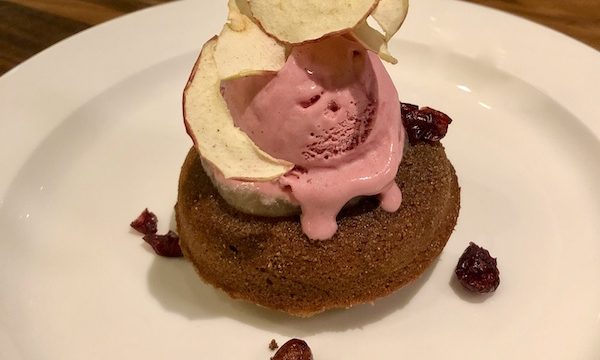 A white plate topped with a cake donut and cranberry ice cream at Sue Zemanick's Zasu