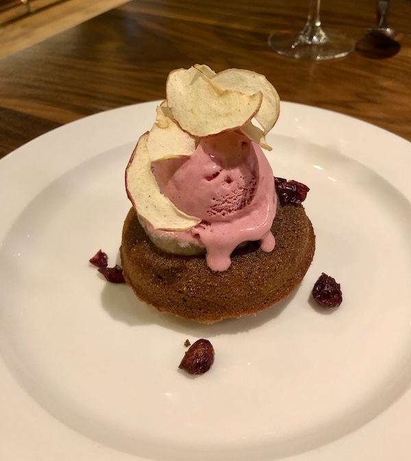 A white plate topped with a cake donut and cranberry ice cream at Sue Zemanick's Zasu