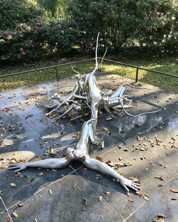 Sprawling stainless steel monkeys sculpture at the Bestoff Sculpture Garden