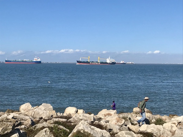 An inlet with tankers on the sea at Galveston Island Texas