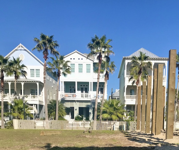A trio of white three story beach houses on Galveston Island Texas
