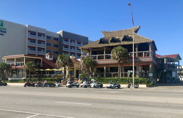 A large wood beachside restaurant on Galveston Island Texas