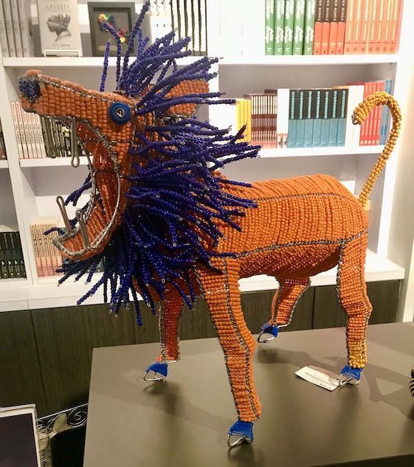 An orange and purple beaded lion at the Holocaust Museum Houston