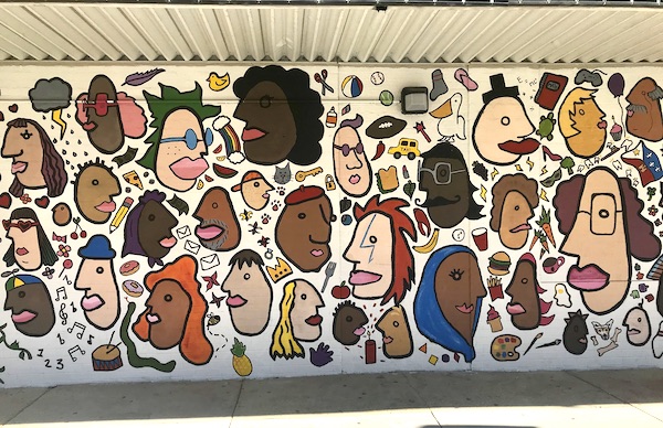 A colorful mural of cartoon heads in Southwestern Louisiana