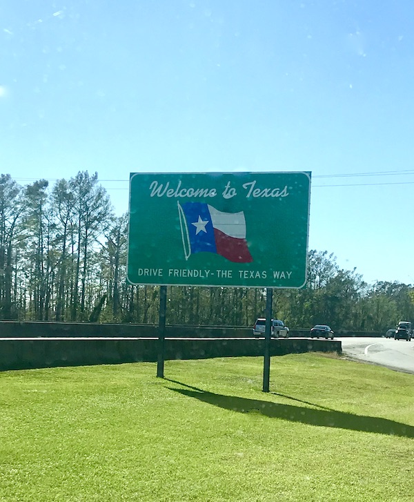 A Welcome to Texas sign with the state flag from Texas at Last!