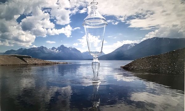 A photo of a champagne flute superimposed on a lake at The Houston Center for Contemporary Craft