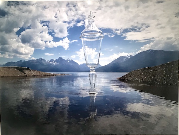 A photo of a champagne flute superimposed on a lake at The Houston Center for Contemporary Craft