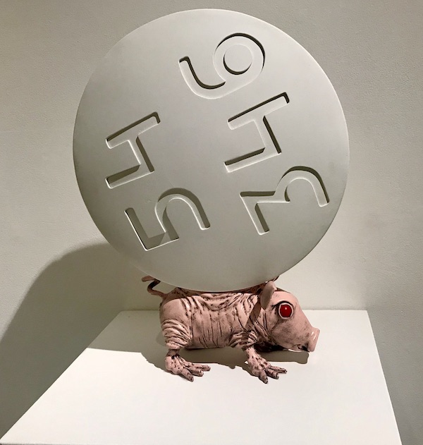 A small pink pig with a huge aspirin on its back at The Houston Center for Contemporary Craft