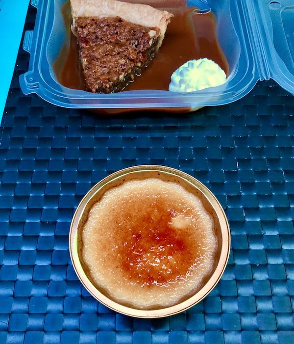 Tidbits of Life in New Orleans a white and caramel dessert on a black woven placemat.
