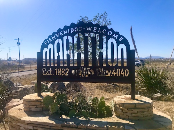 A black sign letting you know that you are in the town of Marathon on the way to Big Bend National Park Texas