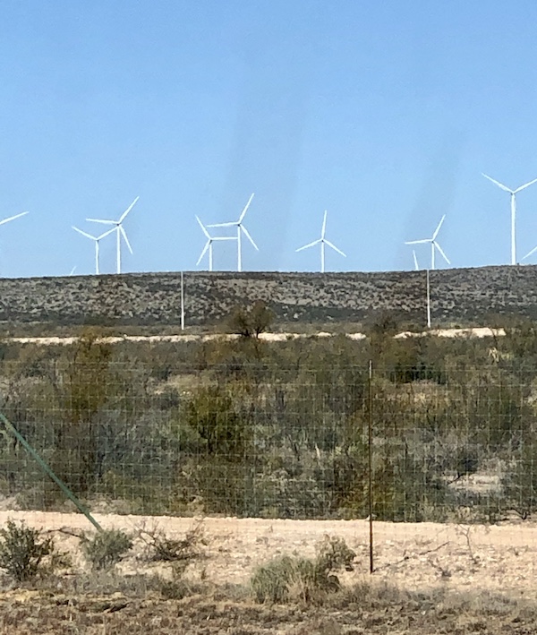 A field of white windmills along the highway to Fort Stockton Texas