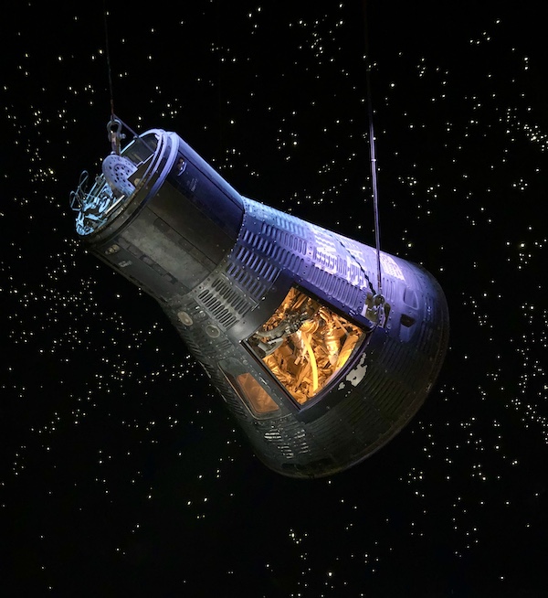 A command module appears to be floating in space at NASA Space Center Houston