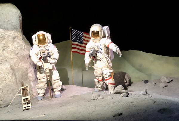 Two astronauts exploring the moon at NASA Space Center Houston
