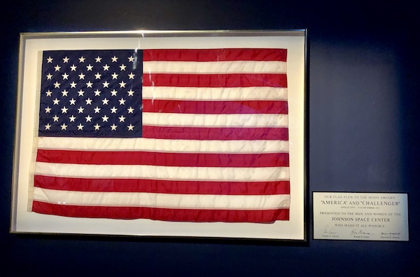 An American flag in a frame hangs at NASA Space Center Houston
