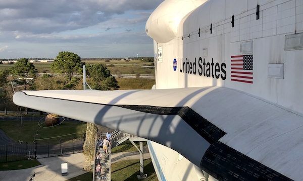A view standing next to the Space Shuttle at NASA Space Center Houston
