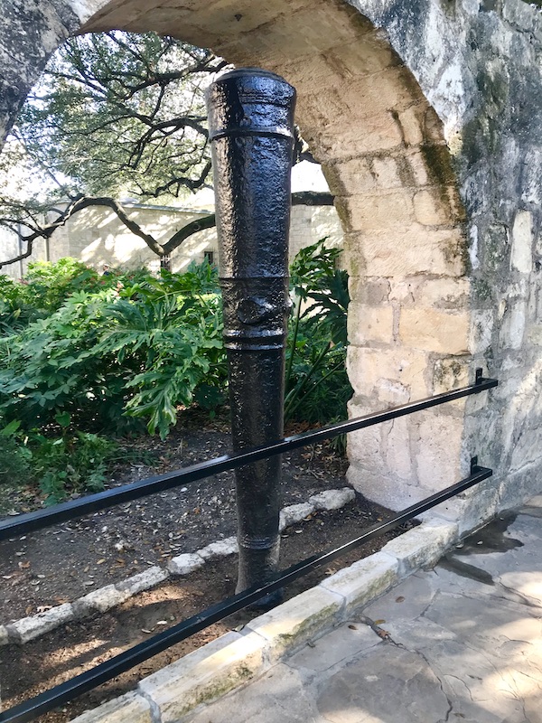 Antique canon barrels in an arch at the Alamo
