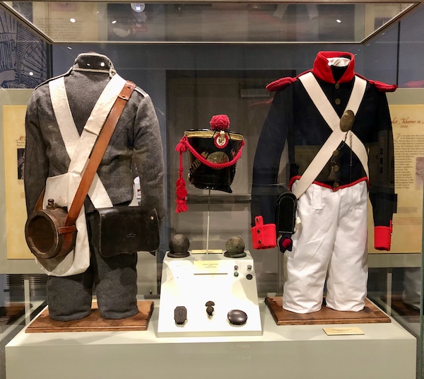 A display of Texas Revolution uniforms help us Remember the Alamo