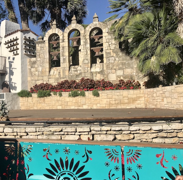 Bell towers and a stage along our San Antonio River Cruise 