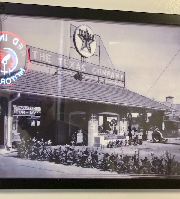 A black and white photo of a gas station/restaurant in Sonora Texas