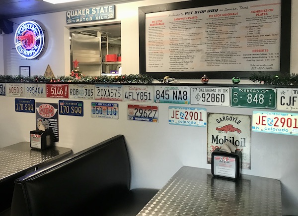 A white board menu and counter at a restaurant in Sonora Texas
