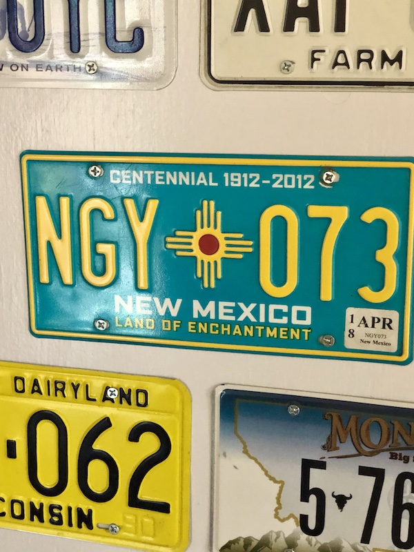 Colorful license plates on display at the Pit Stop BBQ in Sonora Texas